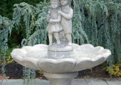 SINGLE TIER LARGE GIRL AND BOY UNDER UMBRELLA FOUNTAIN